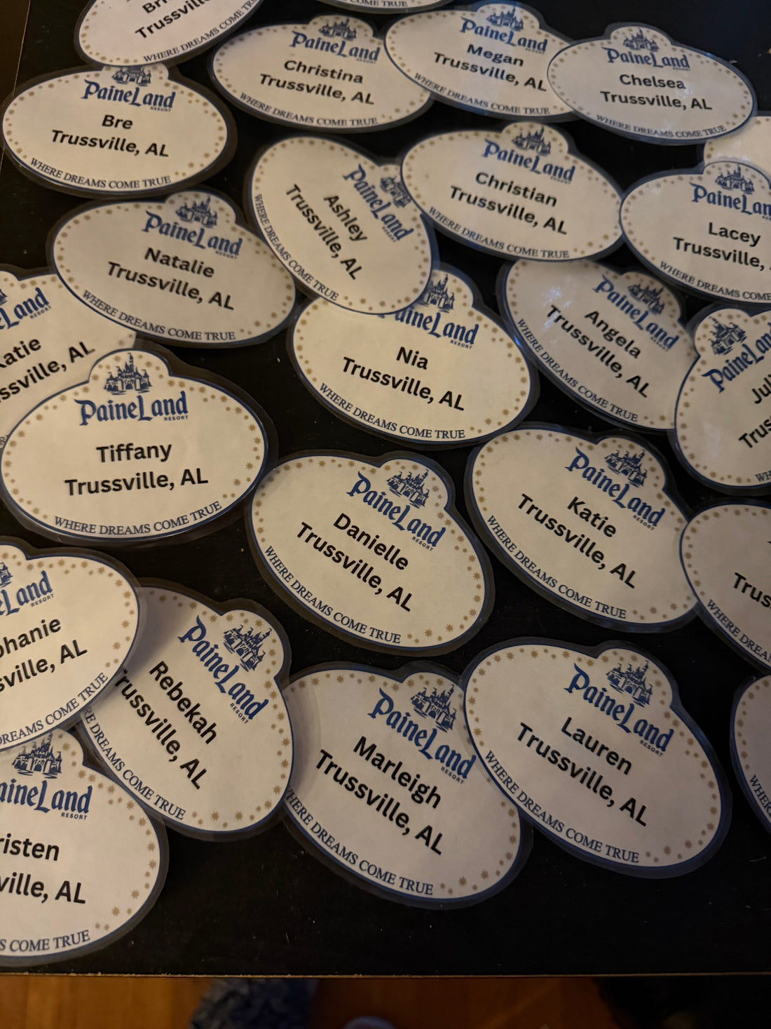 Finished Paineland Cast Member name badges laid out together